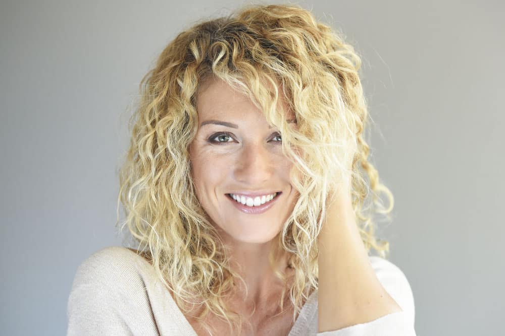 Woman smiling with curly hair