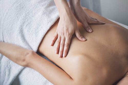 Young woman relaxing with hand massage at beauty spa-img-blog