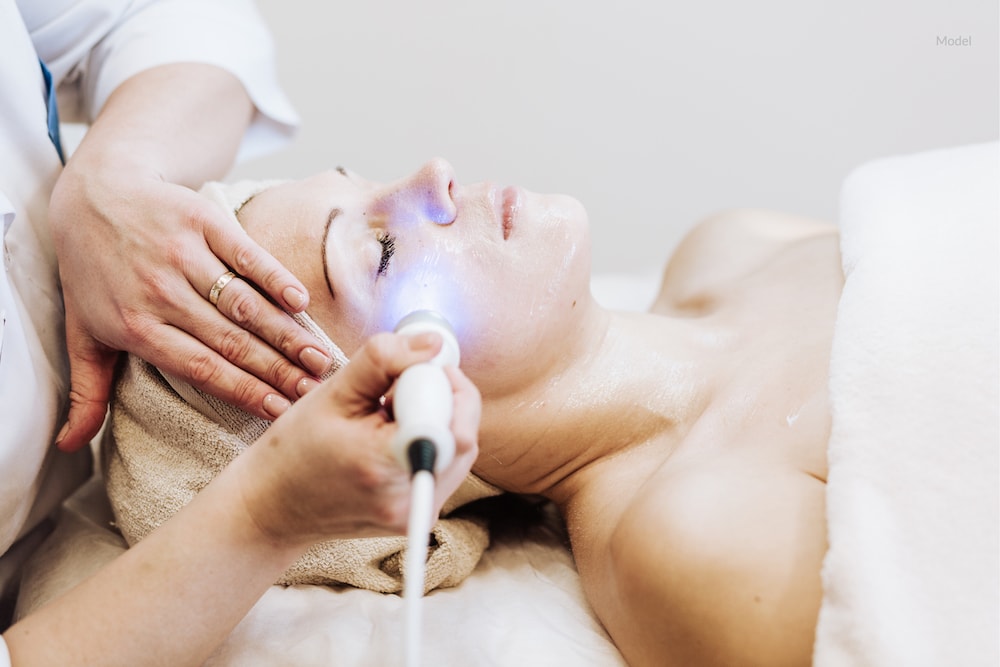Woman getting a laser treatment on face