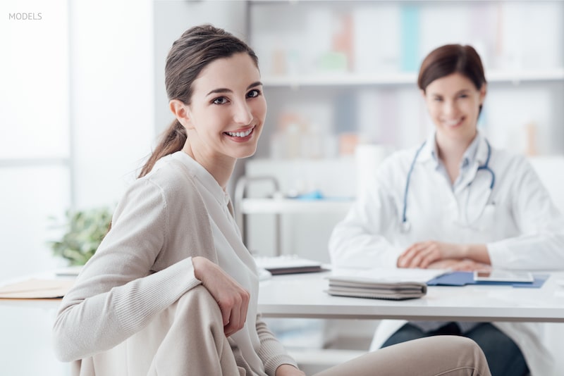 Woman meeting with a female physician for a consultation.