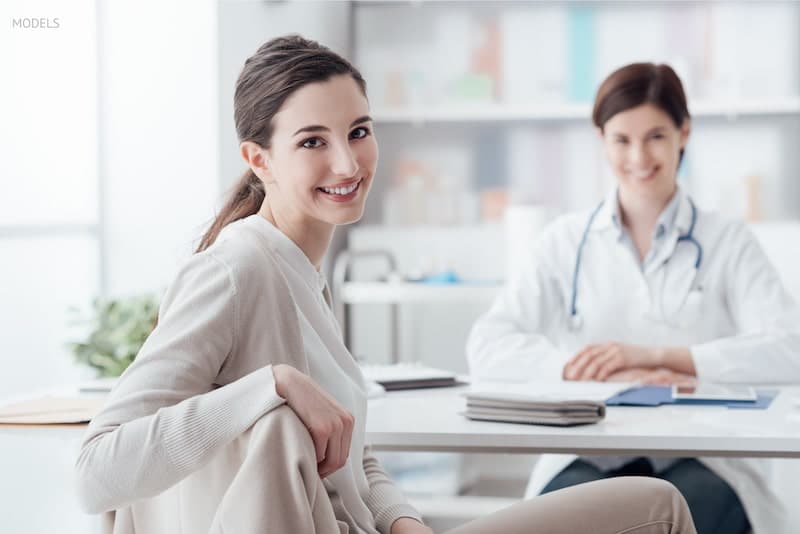 Woman meeting with a female physician for a consultation.