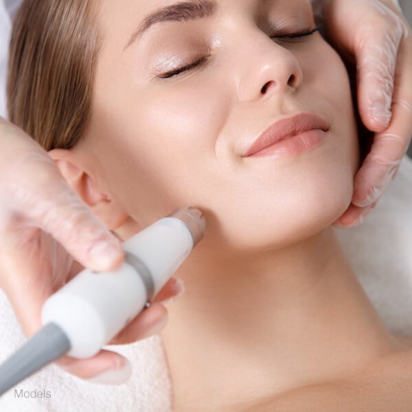 Young woman getting laser treatment