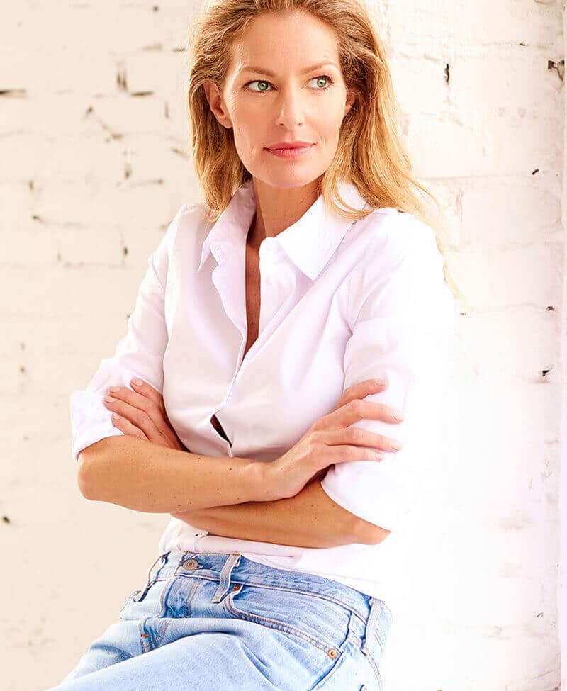 Mature woman in pink shirt and jeans